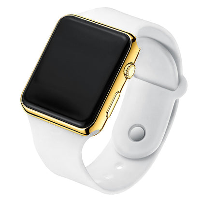 Digital electronic wristwatch with black screen, gold case, white silicone strap.
