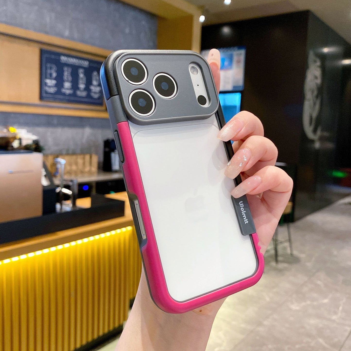 Dual-color border phone case with pink border, clear white back, and four-corner camera openings