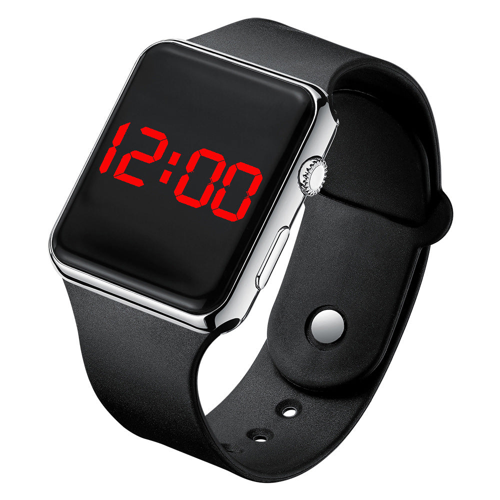 Digital electronic wristwatch with black screen showing red time, gunmetal case, black strap.