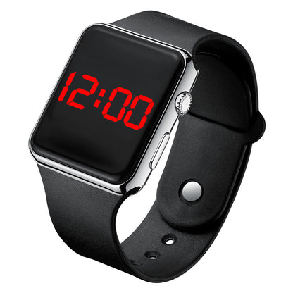 Digital electronic wristwatch with black screen showing red time, gunmetal case, black strap.