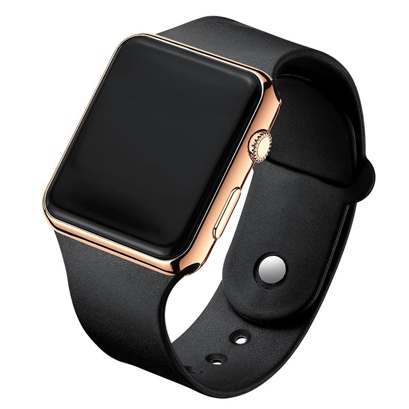 Digital electronic wristwatch with black screen, rose-gold case, black silicone strap.