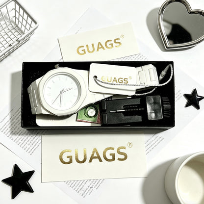 Quartz wristwatch set with white dial, silver metal bracelet and black strap