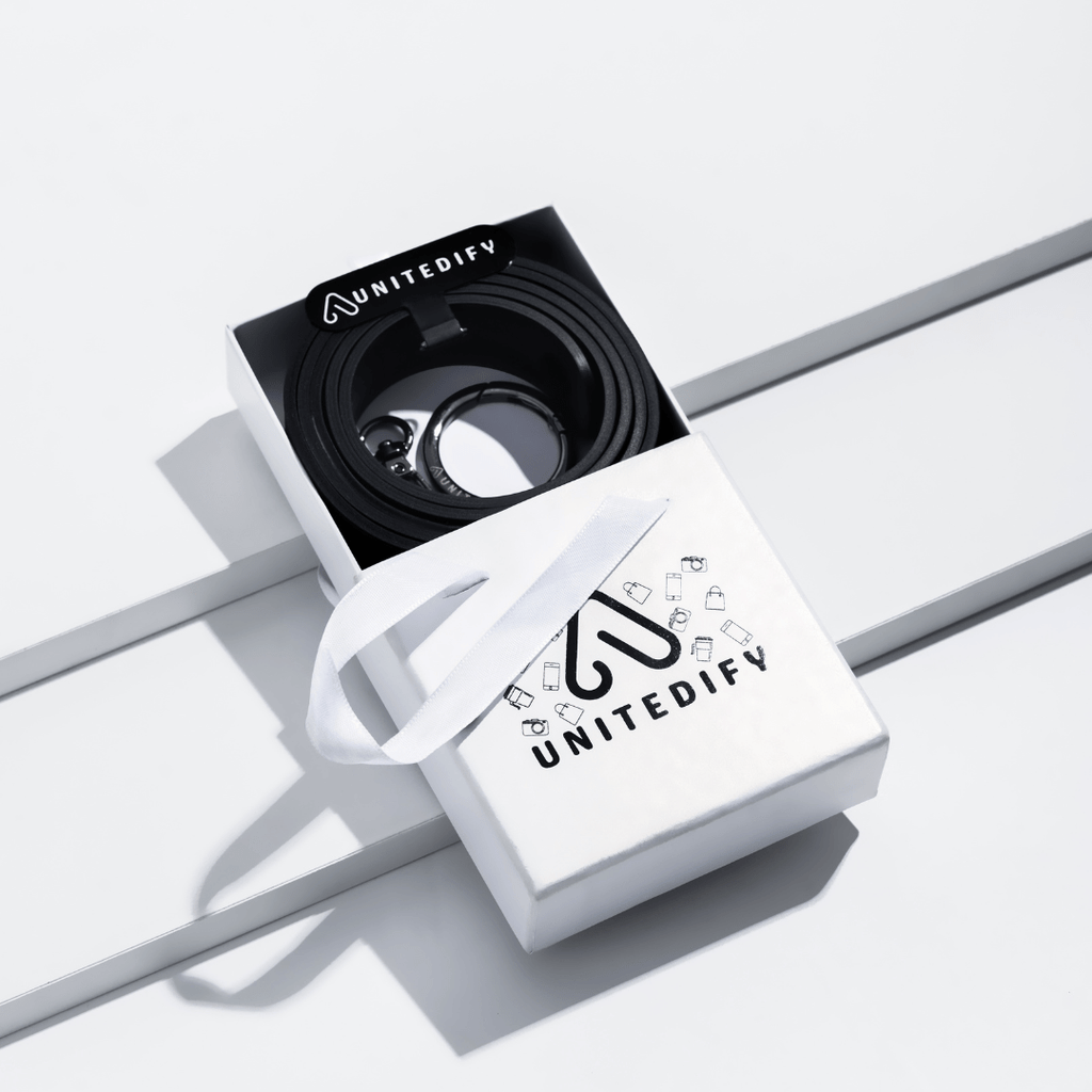 Phone strap with black patterned loops, shown in a gift box set by Unitedify