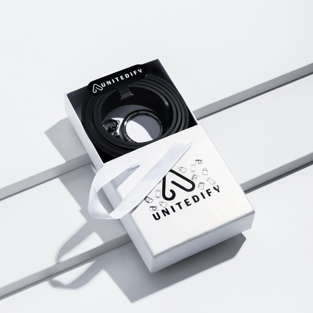Phone strap with black patterned loops, shown in a gift box set by Unitedify