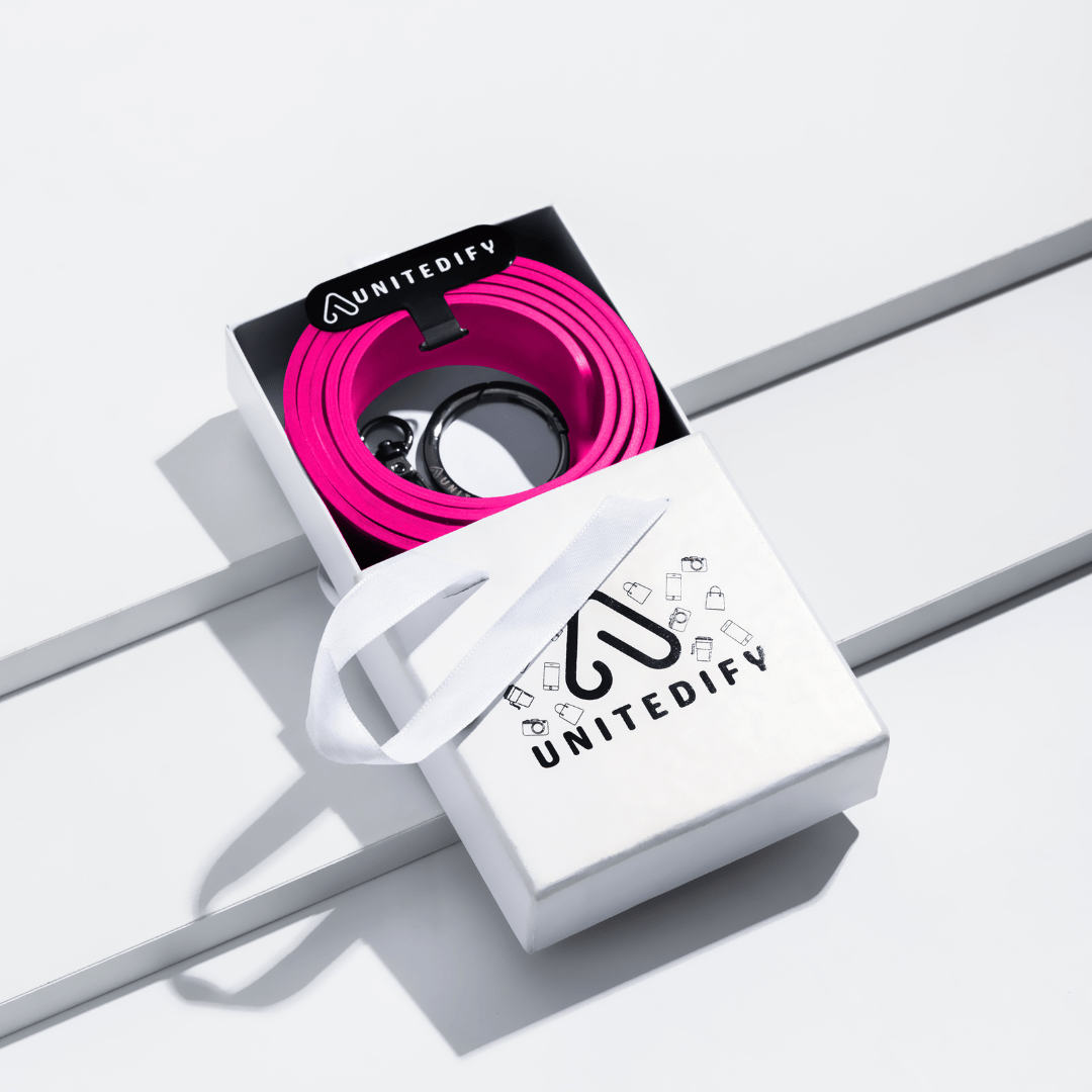 Phone strap with bright pink patterned loops, shown in a gift box set by Unitedify