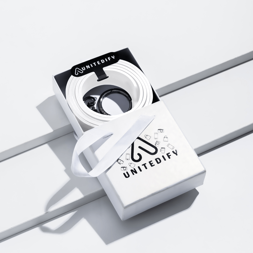Phone strap with white patterned loops, shown in a gift box set by Unitedify