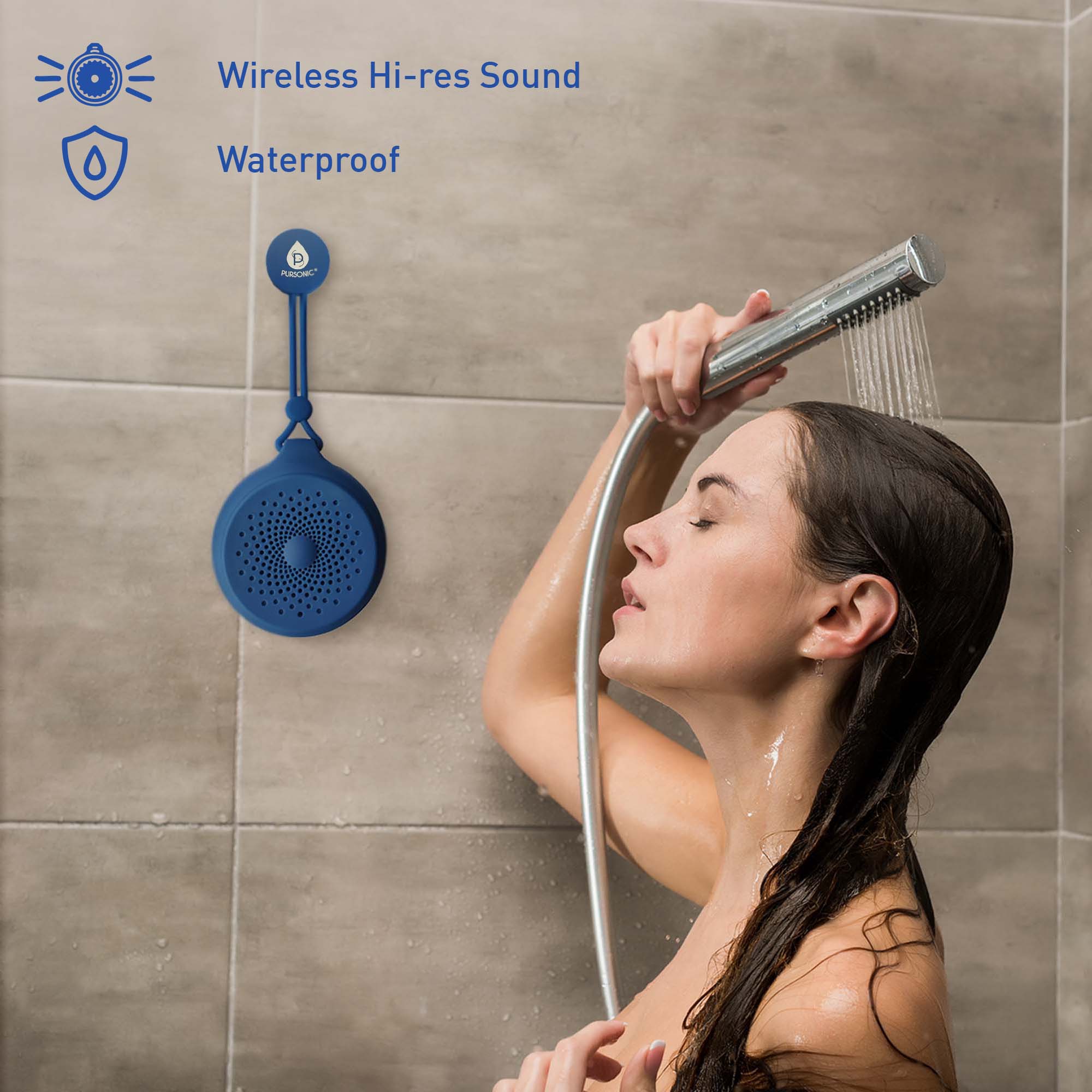 Round wireless speaker with tether, water droplets visible on grille