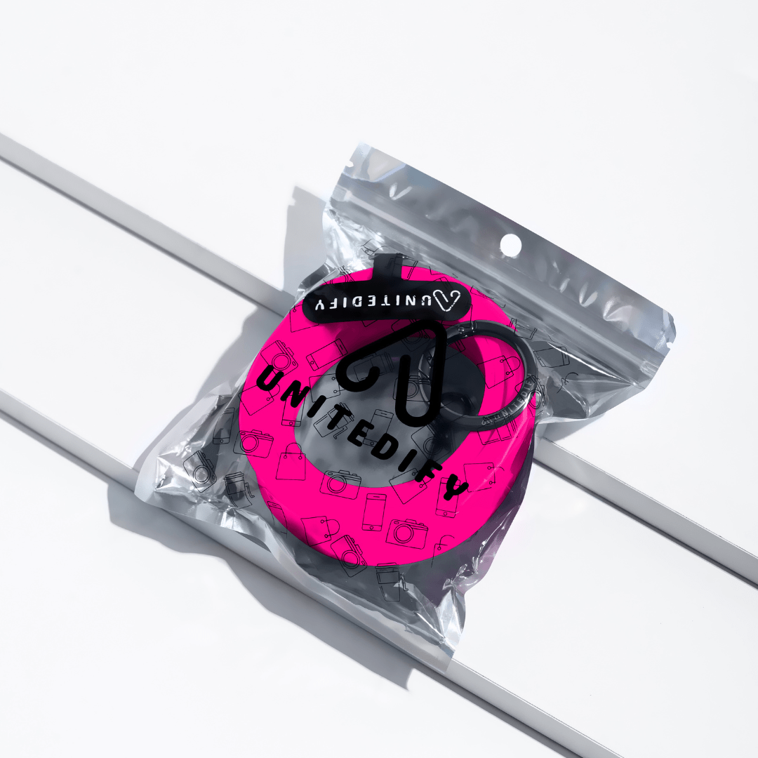 Phone strap with pink patterned loops, shown in a sealed polybag by Unitedify