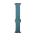 Blue-teal silicone Apple Watch sport strap with pin holes and keeper slots