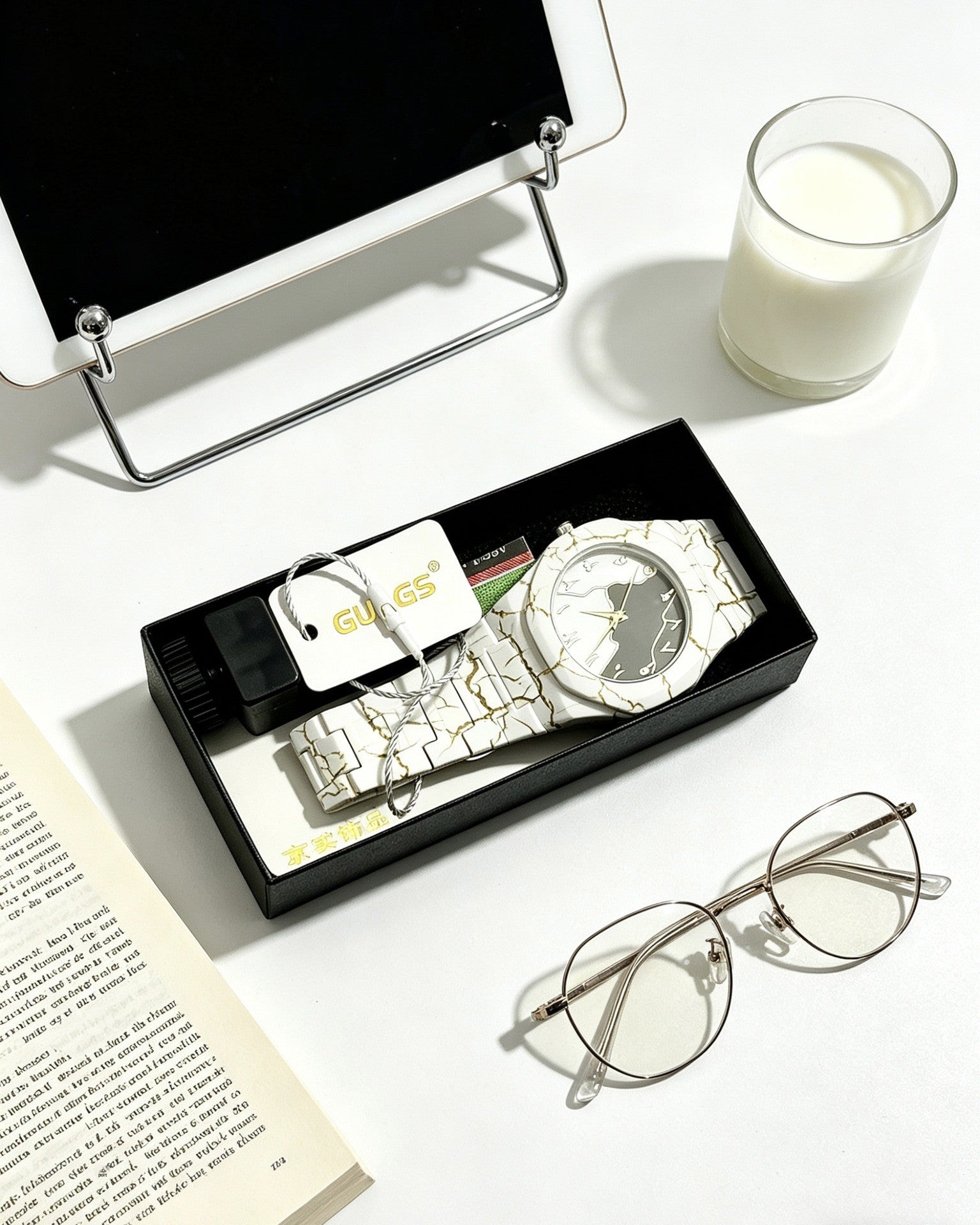 Quartz wristwatch set in open box with white dial watch