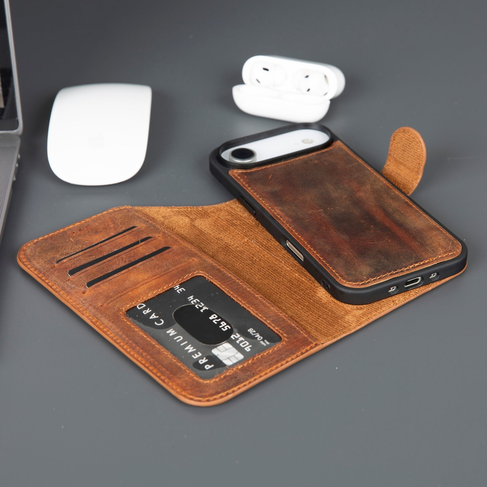 Brown leather iPhone wallet case with tan lining and card slots