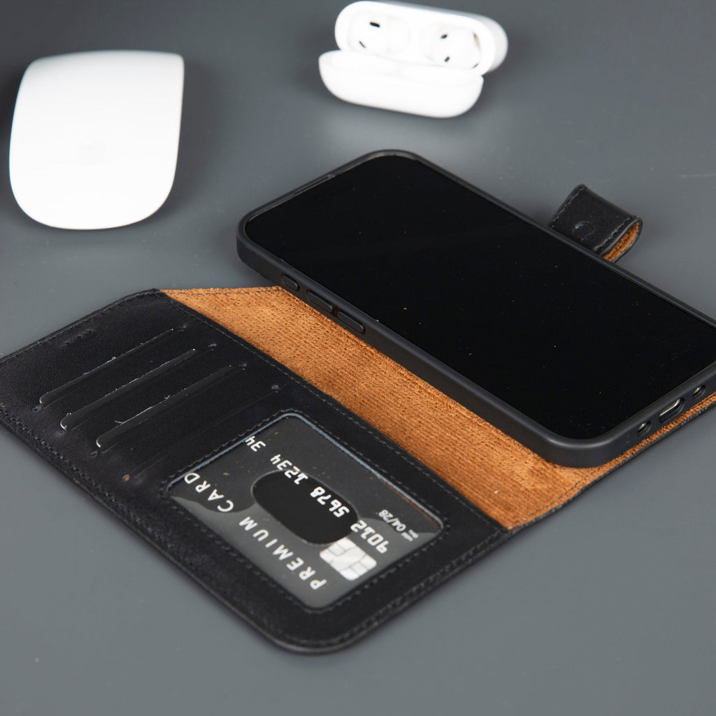 Leather iPhone wallet case in black with tan card holder, opening flap and card slot