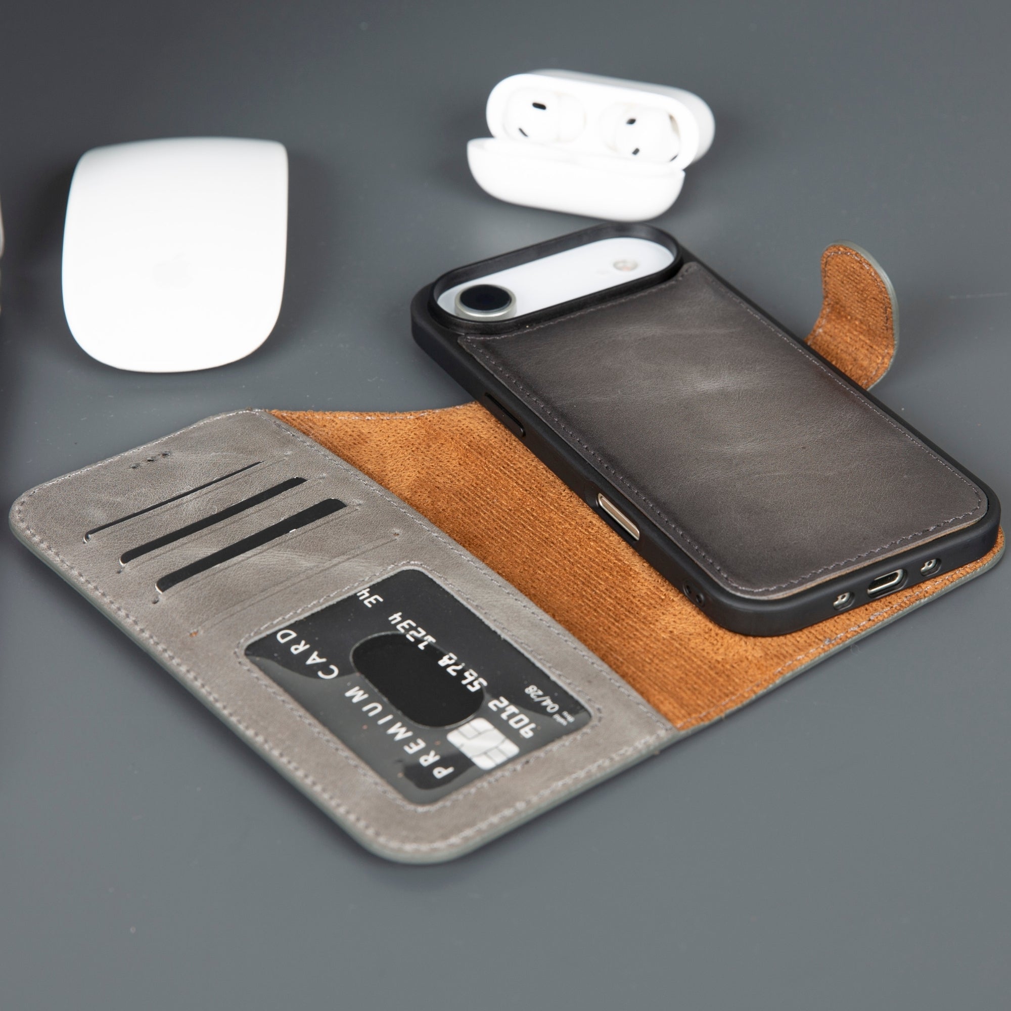Leather iPhone wallet phone case with black exterior and tan card slots