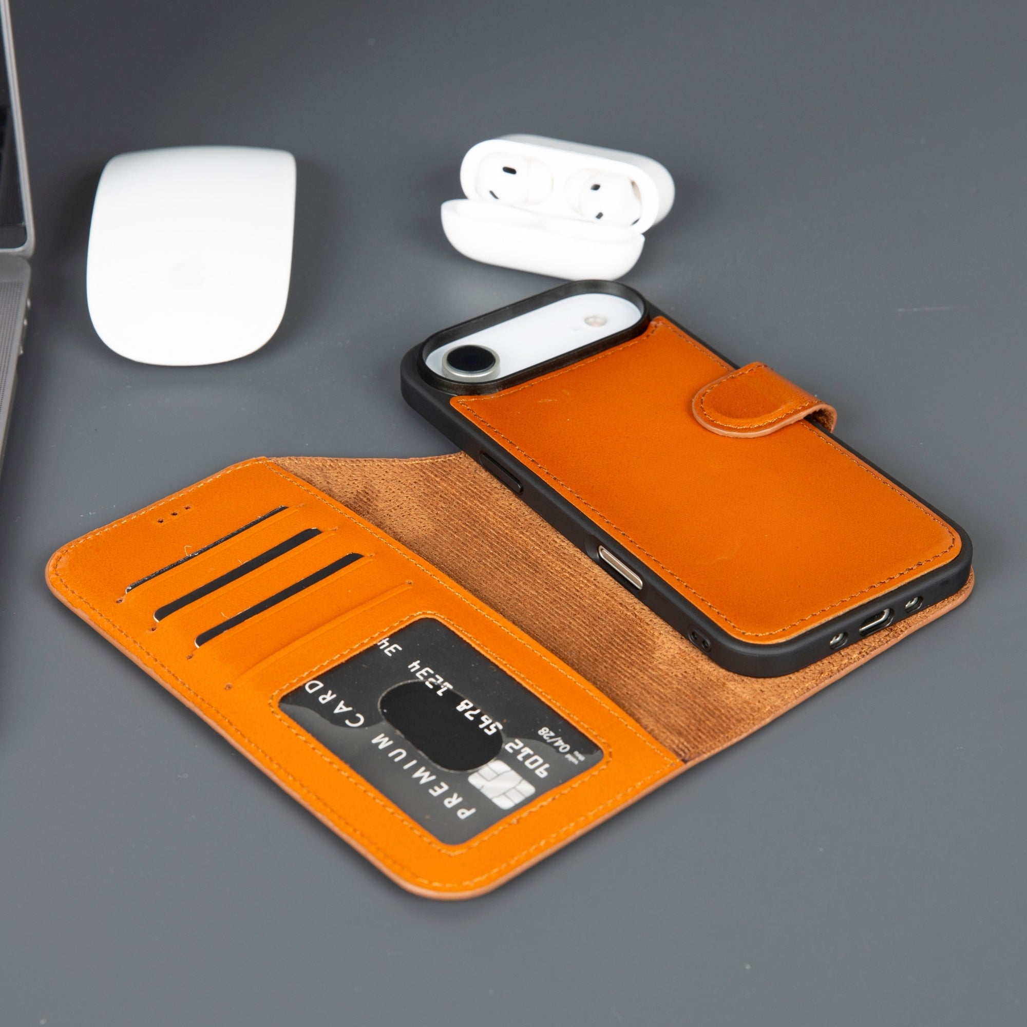 Orange leather iPhone wallet case with tan lining and card slots