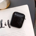 Black ribbed AirPod case with small side handle, viewed from above