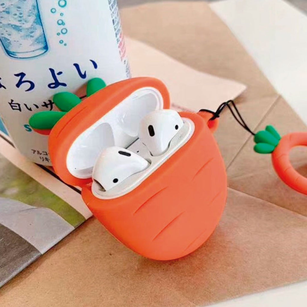 Carrot-shaped AirPods silicone case in orange with open lid and white earbuds inside