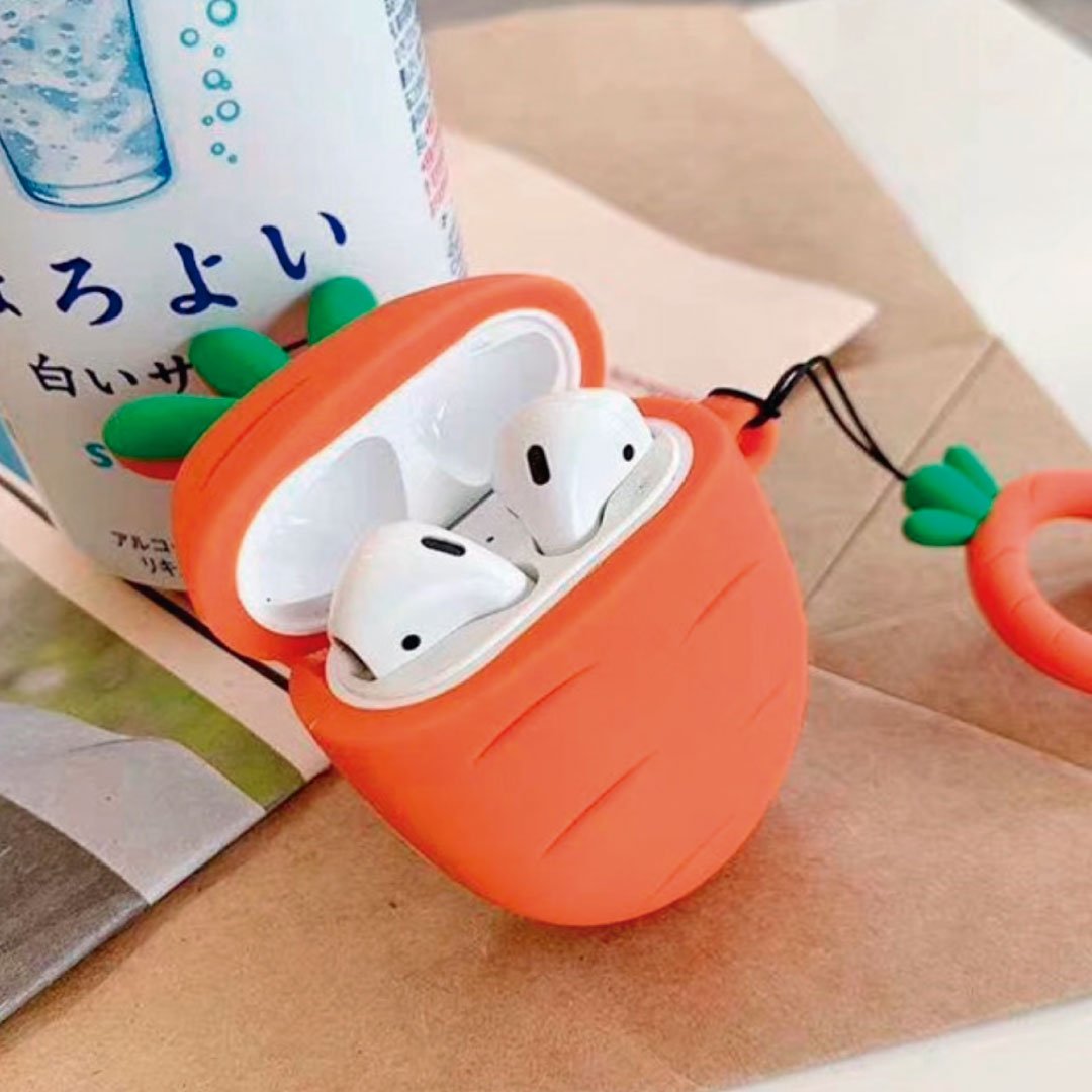 Carrot-shaped AirPods silicone case in orange with open lid and white earbuds inside