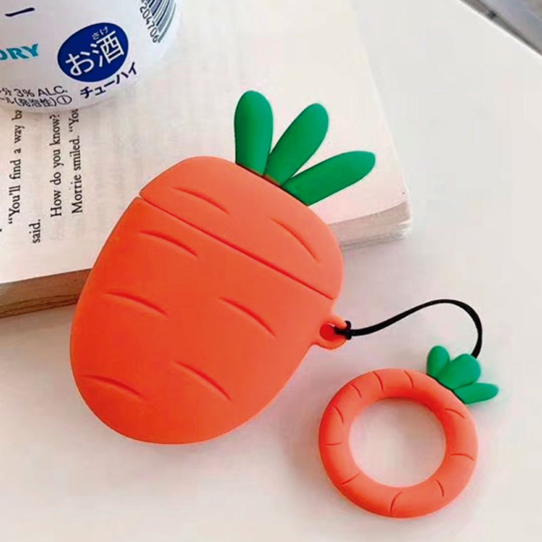 Carrot-shaped AirPods case with green leaf design and orange strap, plus matching ring