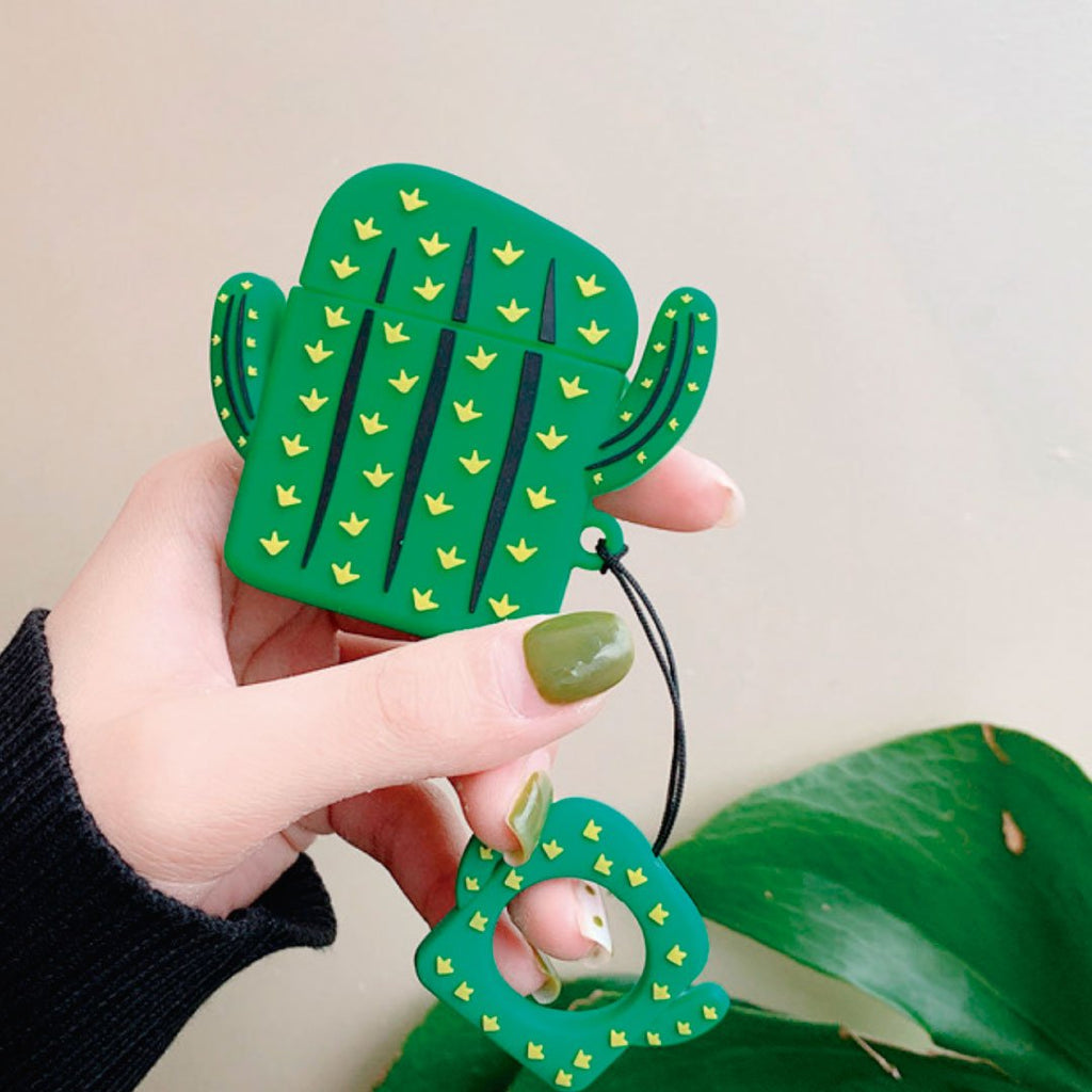 Green cactus AirPod Pro case with yellow motifs and small cactus charm on lanyard