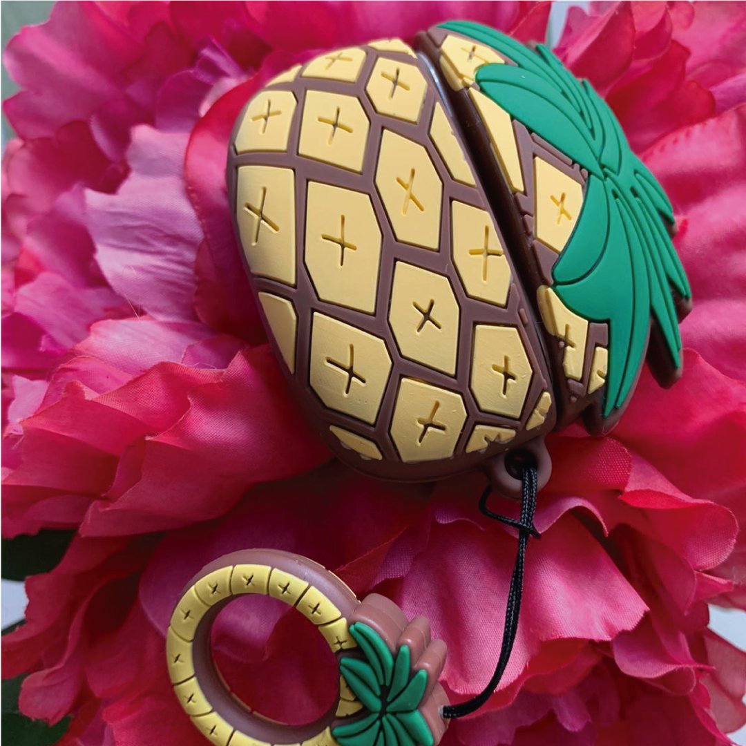 AirPod Pro case with grid pattern and teal pineapple charm