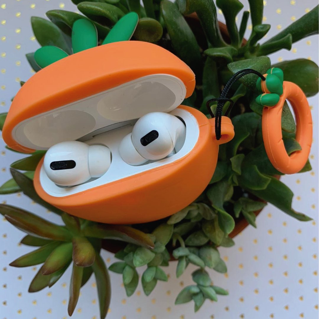 Carrot-shaped AirPods Pro case, orange shell open with white earbuds inside
