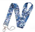 Blue floral mobile phone strap with metal clasp and black safety cord