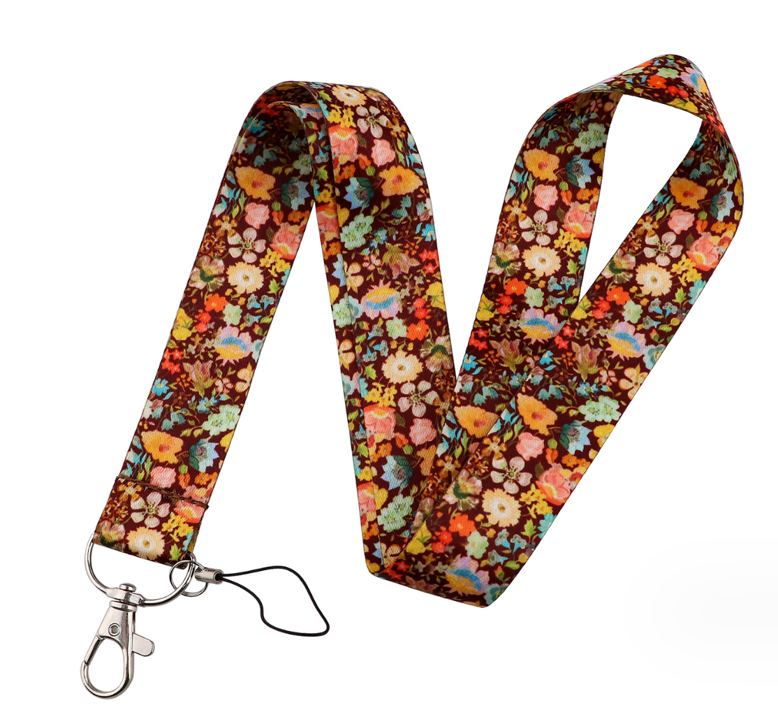 Brown floral mobile phone strap with metal clasp and black safety cord