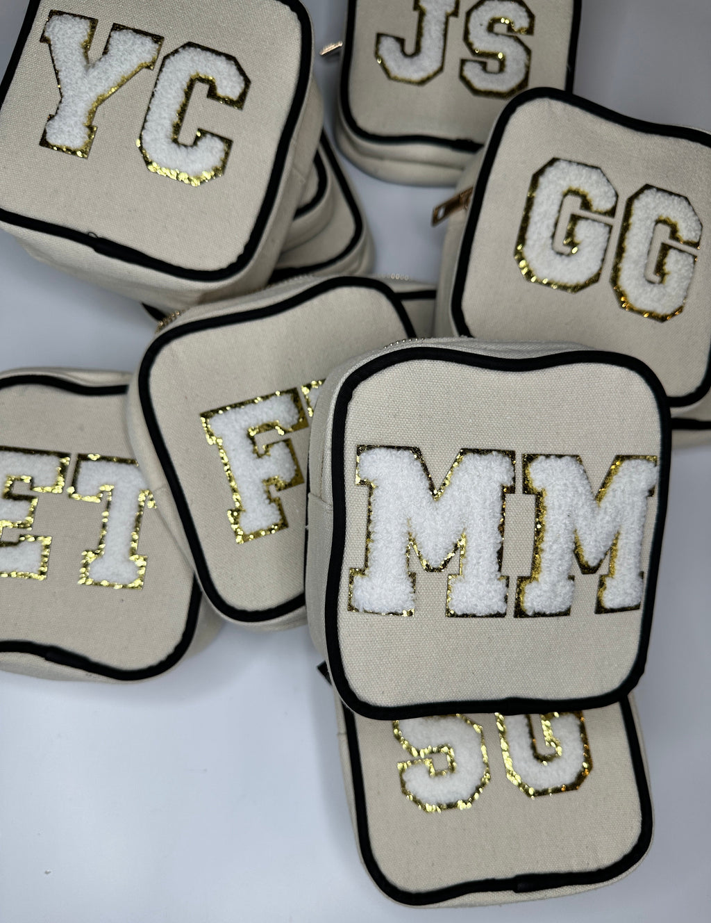 Square zip pouch set with embroidered initials, beige fabric and black trim