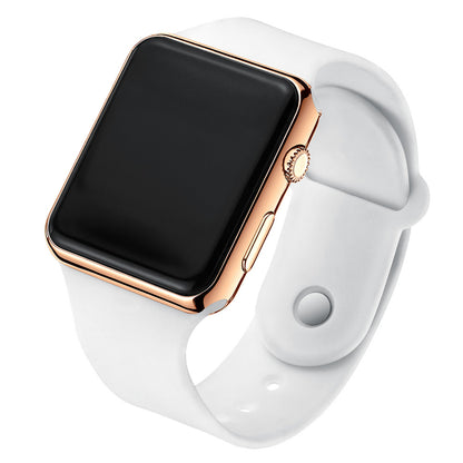 Digital electronic wristwatch with black screen, rose-gold case, white silicone strap.