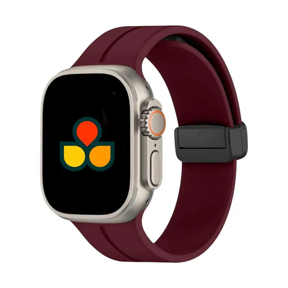 Silicone watch strap in burgundy with black buckle and multiple adjustment holes