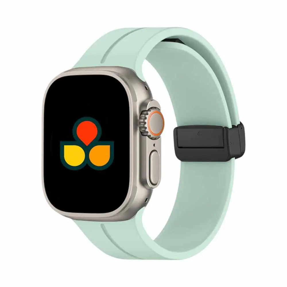Mint green silicone smartwatch strap with black buckle and fastening holes
