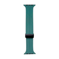 Silicone watch strap in pine green with black buckle and multiple adjustment holes